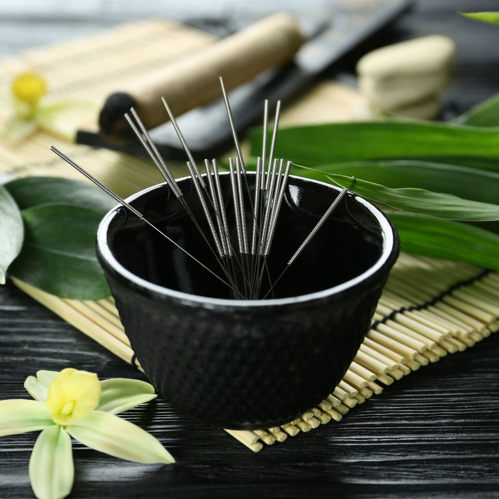 a small pot of very fine acupuncture needles used to treat many conditions